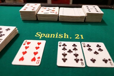 Spanish 21 table showing a stack of 48-card decks missing 10s, with a player hand.